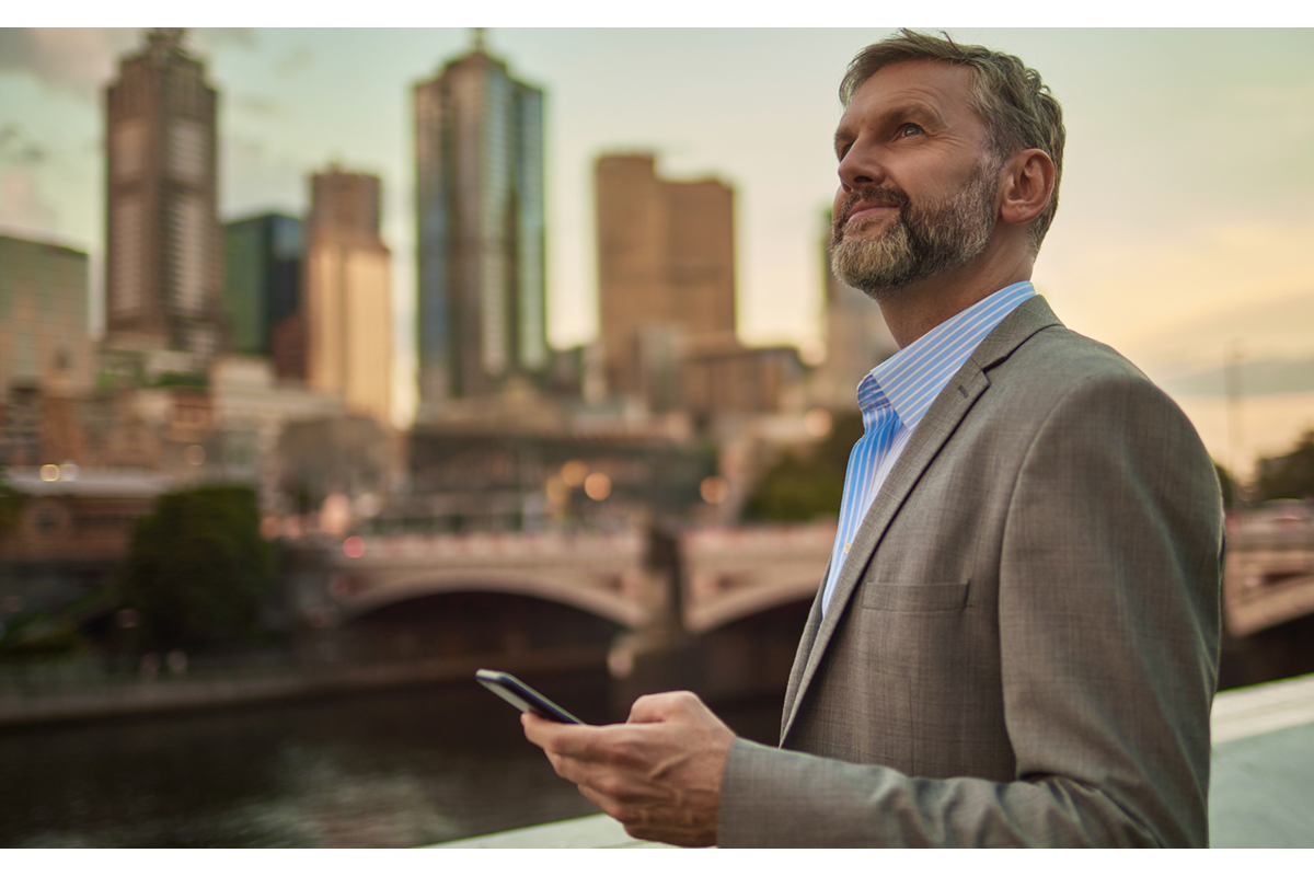 business man looking at phone in melbourne