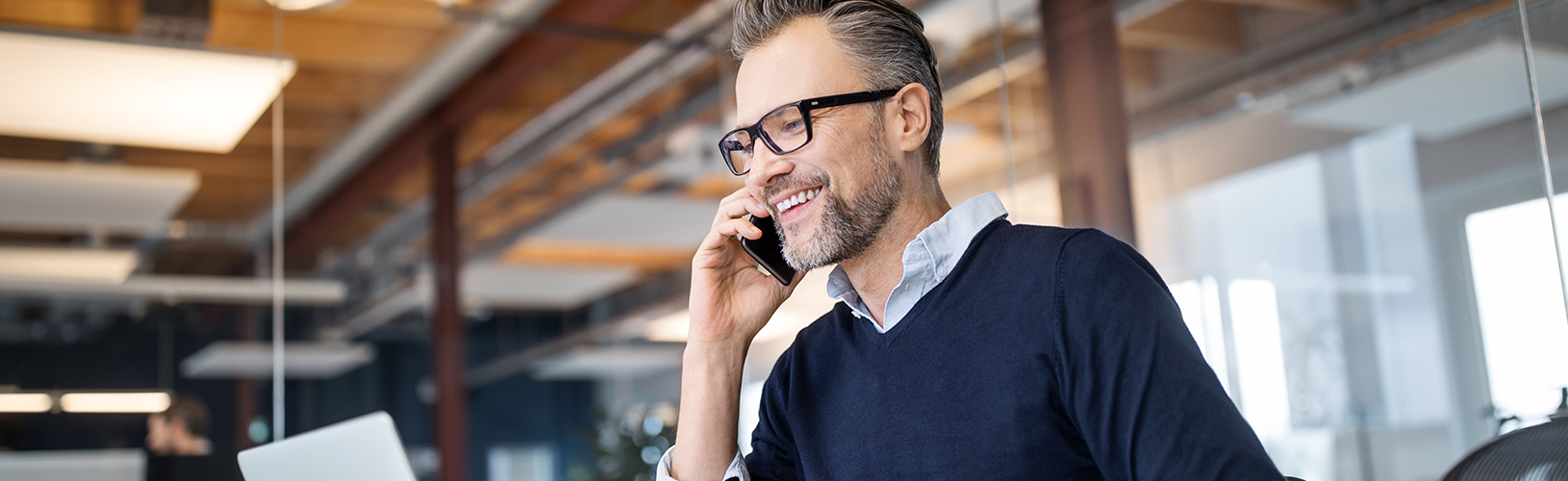 Person on phone discussing the benefits of continuous audit.