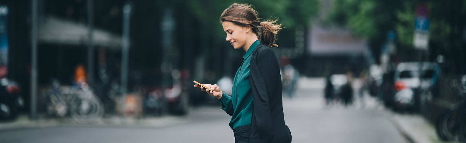 A nonprofit governance professional checking their phone